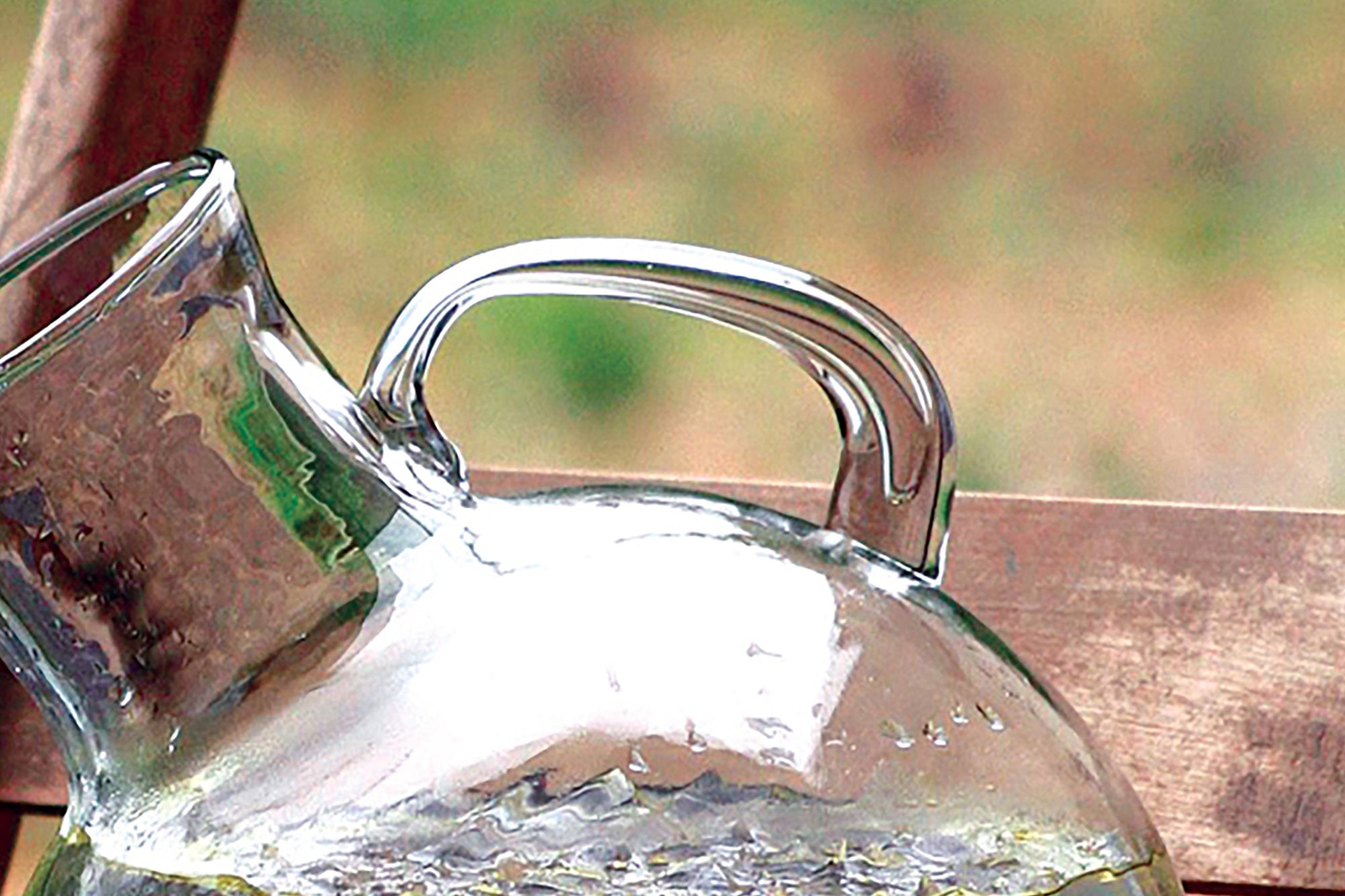 Modern Circular Tilted Glass Beverage Pitcher